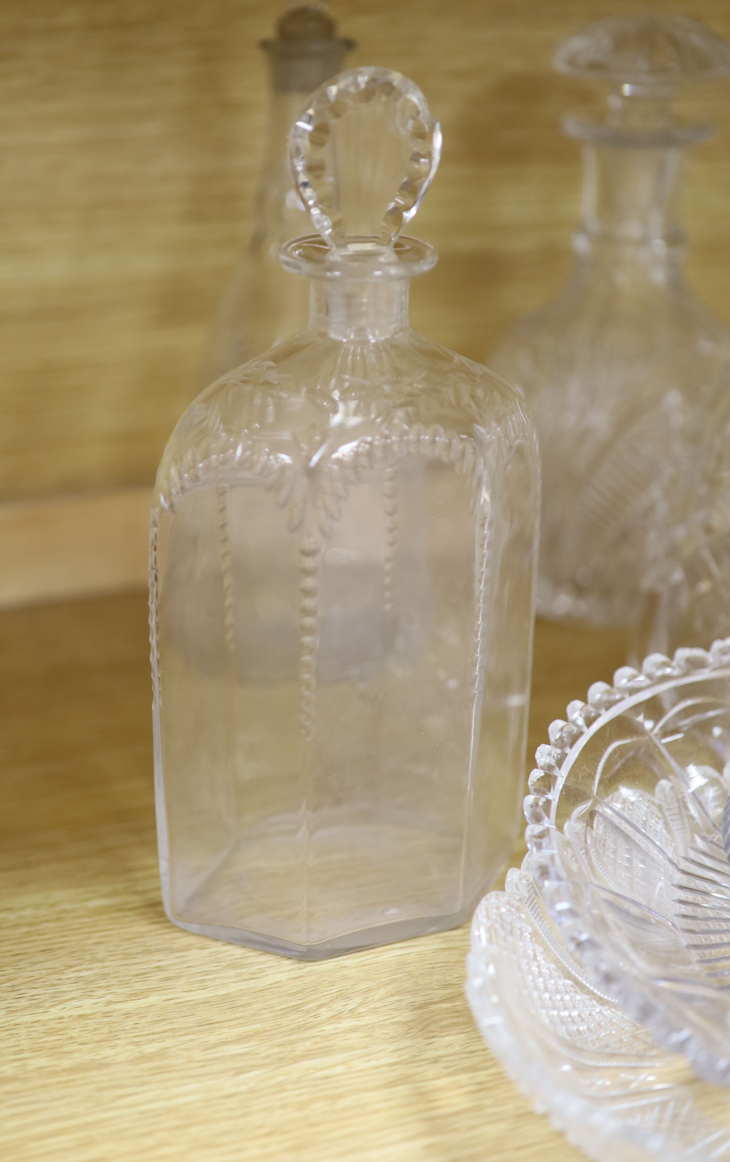 A pair of cut glass decanters, two others and mixed cut glass